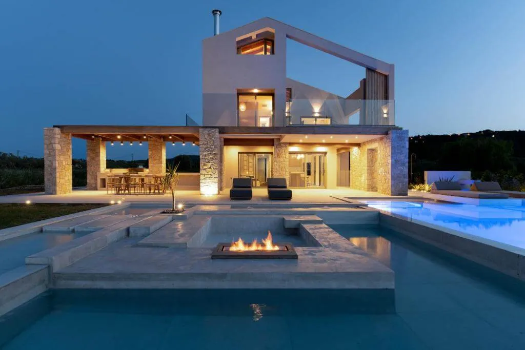 The stunning outdoor swimming pool and terrace of the luxurious Allure Retreat Villa in Gyra, Lefkada.
