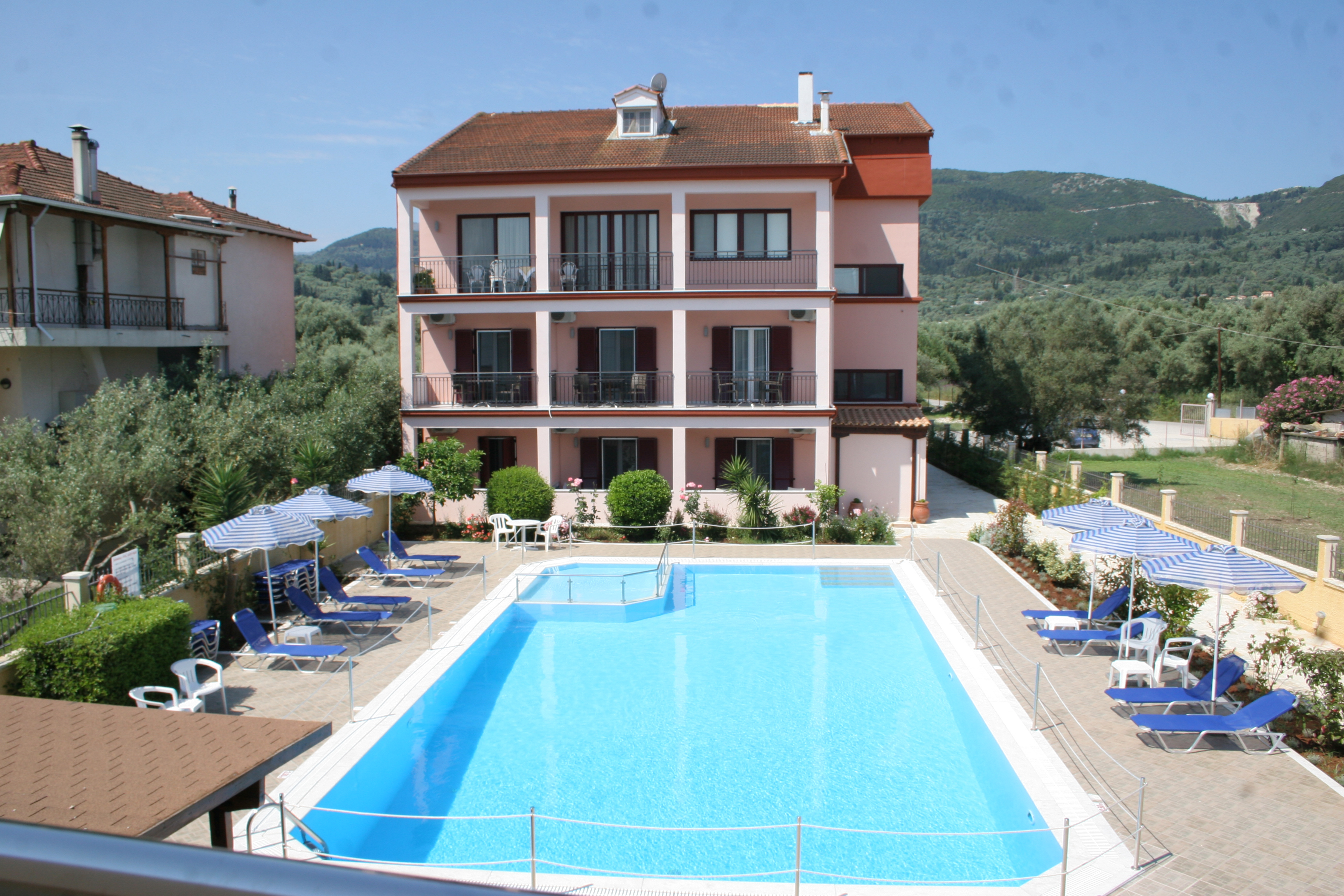 The beautiful swimming pool and well-kept grounds of Christina Studios in Lygia, Lefkada.