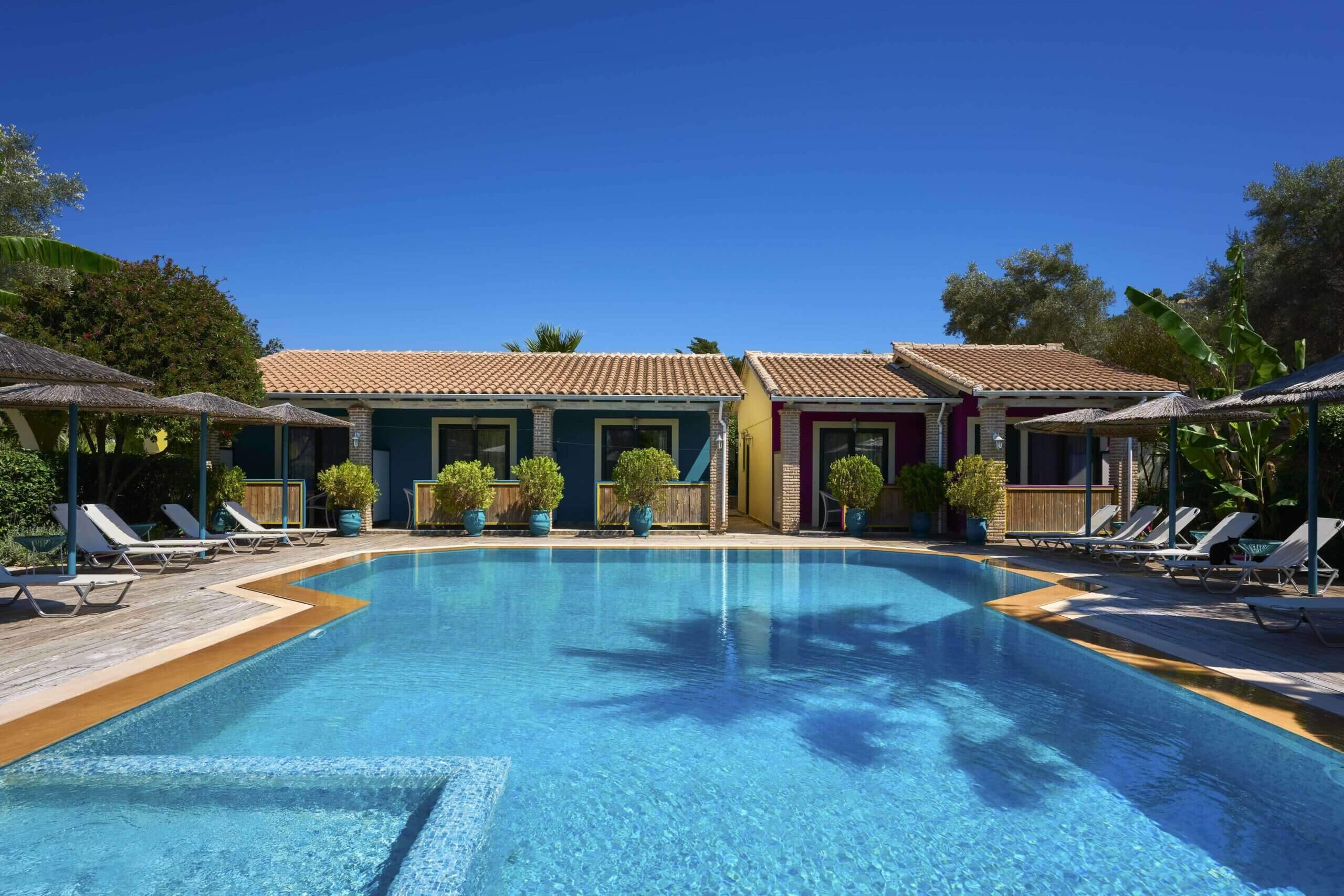 The beautiful Villagio Maistro complex with its large swimming pools nestled within stunning gardens and palm trees.